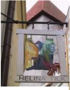 A photo of a hanging building sign.
