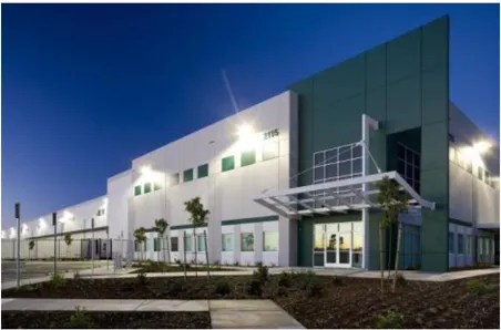 A photo of an office building at night.