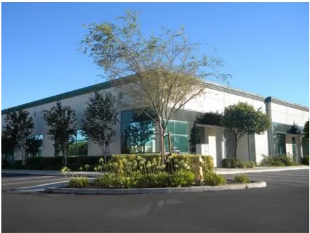 A photo of a commercial building from the parking lot.