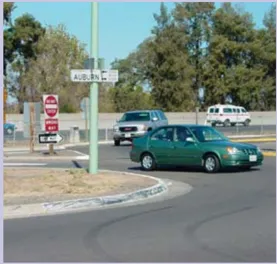 A photo of cars existing an off-ramp.