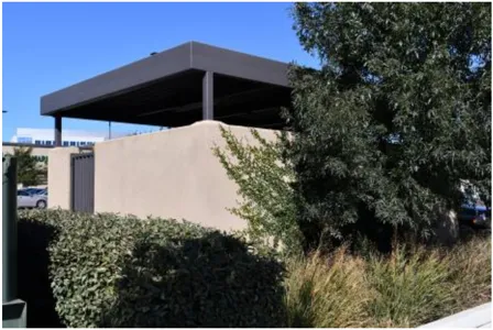 A photo of screened trash enclosures.