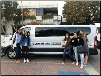 A photo of people with a van.