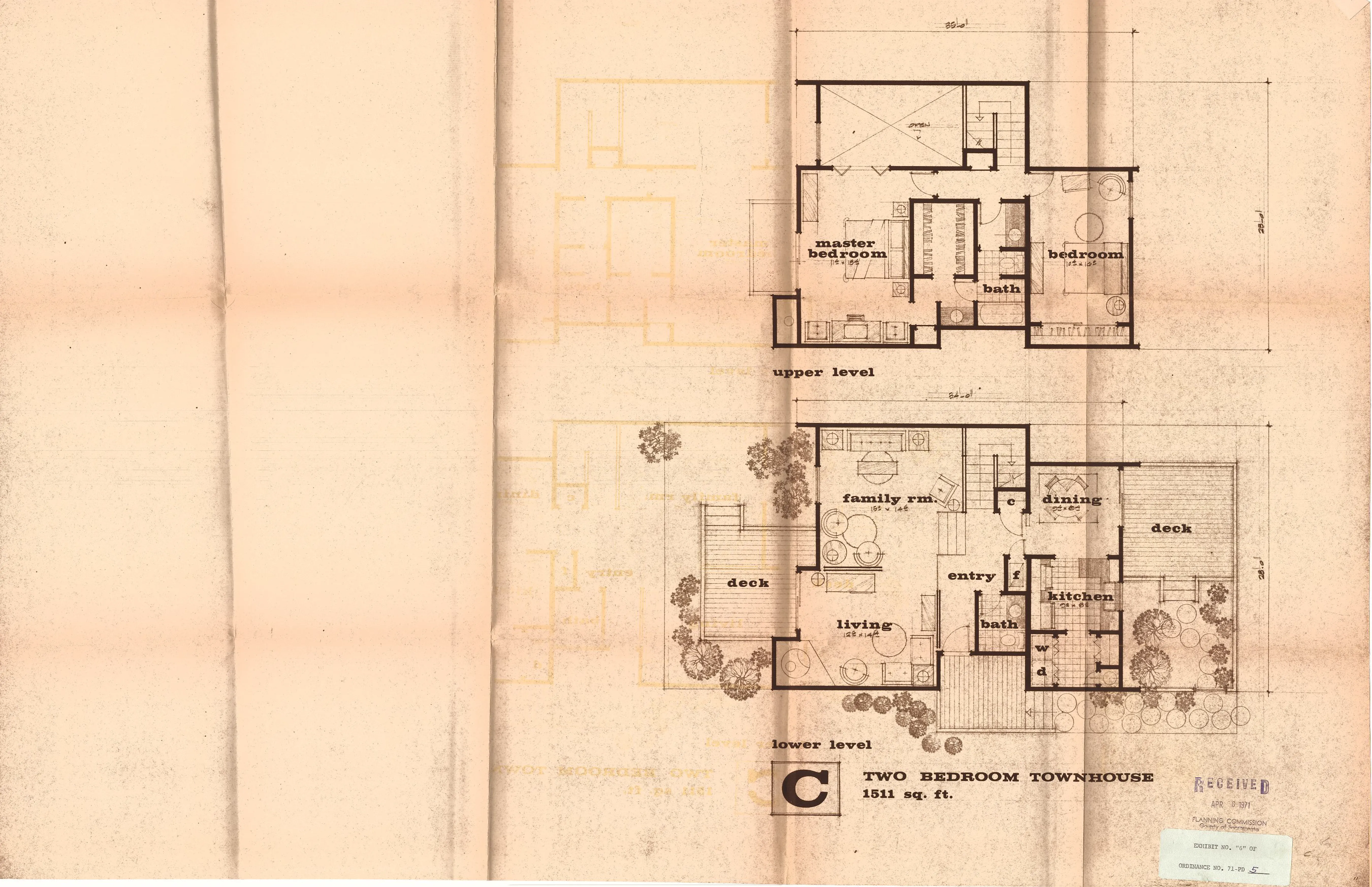 Two-level floor plan of the Type C two-bedroom townhouse (1,511 square feet) with a family room and decks.