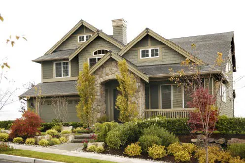 Two story with raised porch and stone veneer accent