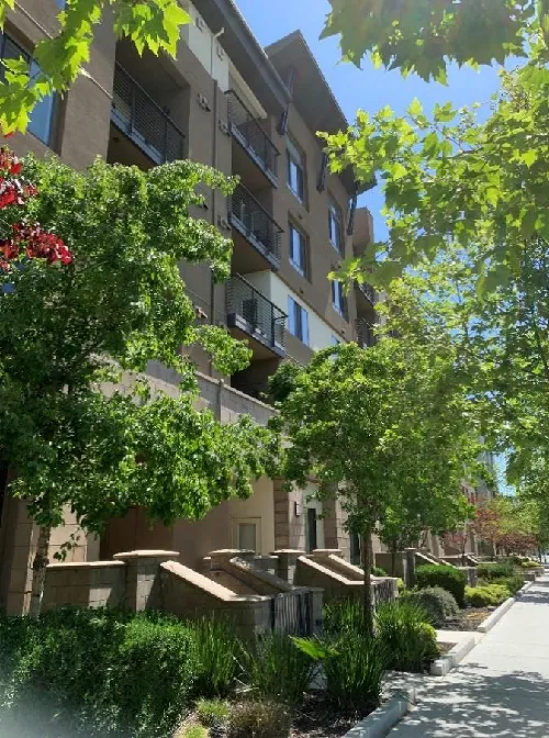 Multifamily building with raised stoops facing the adjacent street