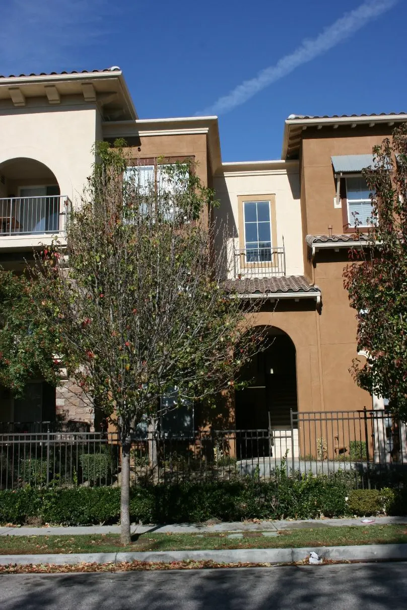 Multifamily building with offset wall planes facing the street