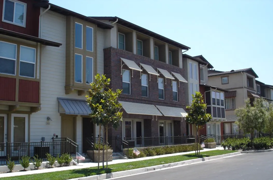 Townhome buildings with a variety of complementary facade materials