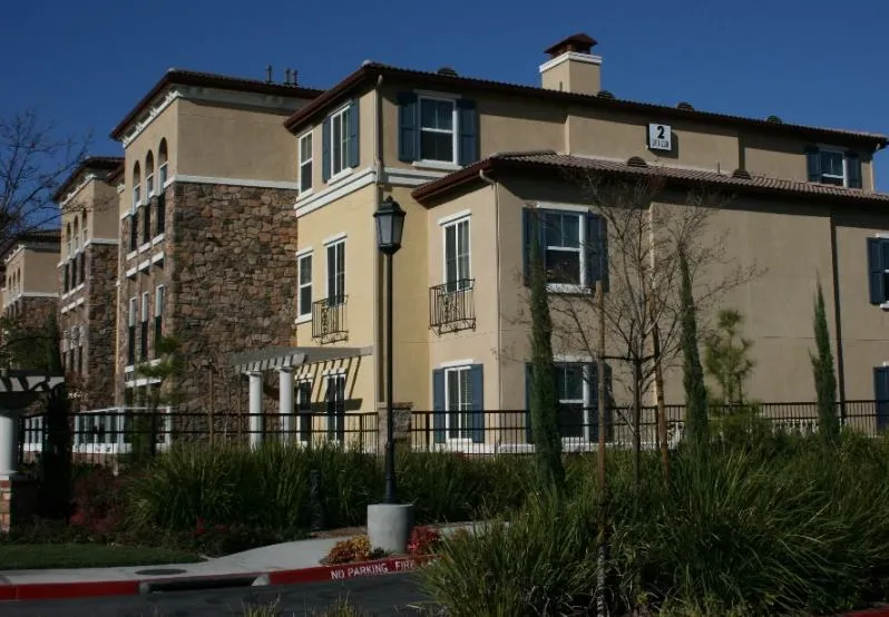 Multifamily building with multiple windows facing the side street