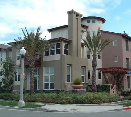 Corner multifamily building with multiple windows facing the street