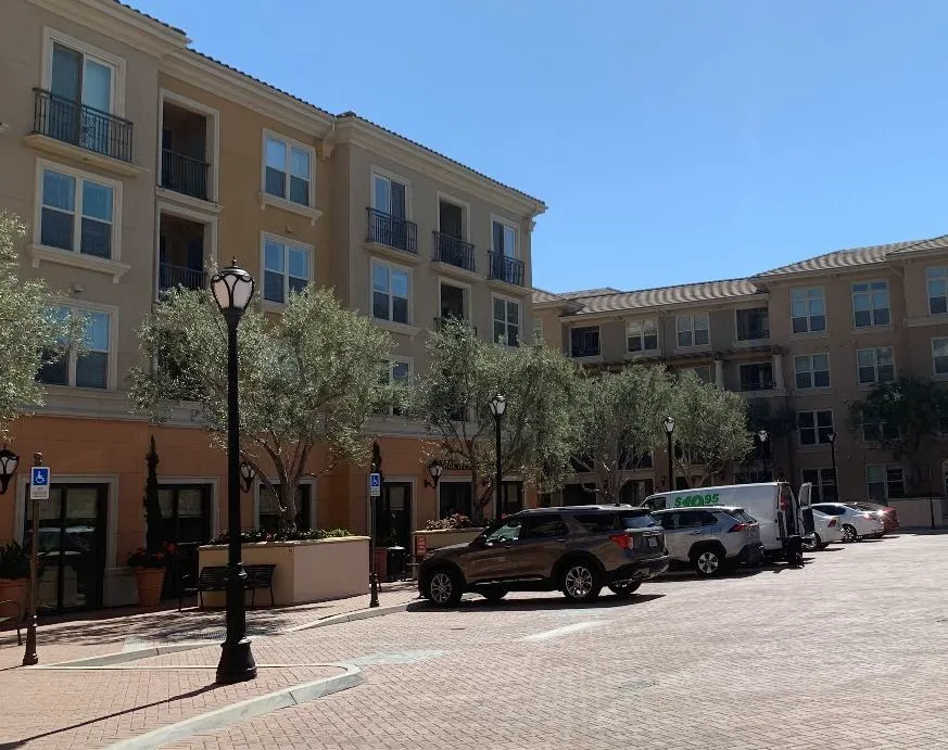 Multifamily building with parking spaces located to the side of buildings