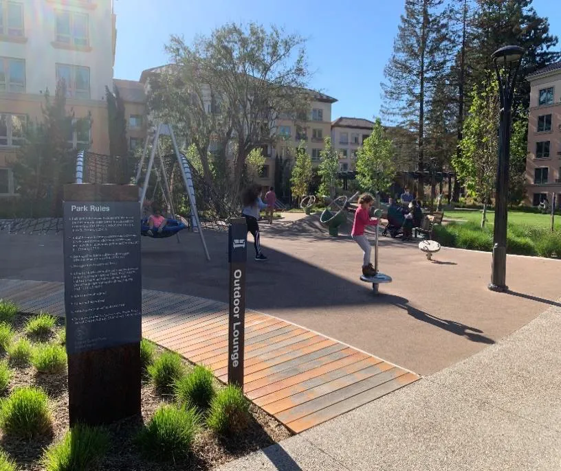 An outdoor lounge and park in a multifamily complex