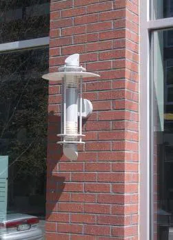 White light fixture on a brick wall.