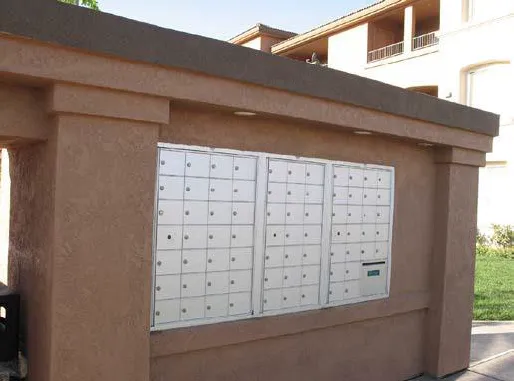 Mail box accessory structure made with materials that match the primary structure.