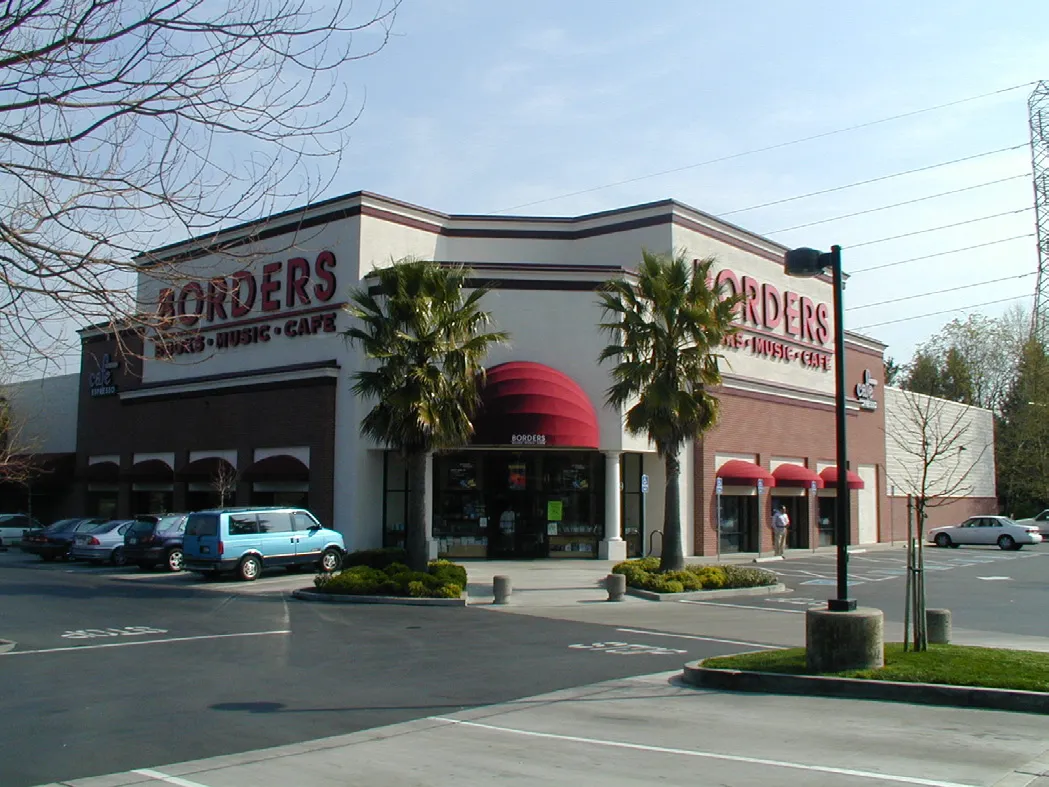 A retail building with storefronts and entry facing the street.