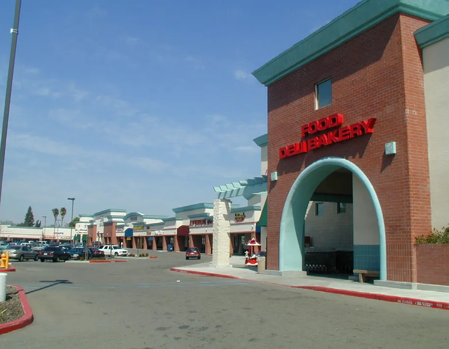 A commercial store front with a uniform architectural style.