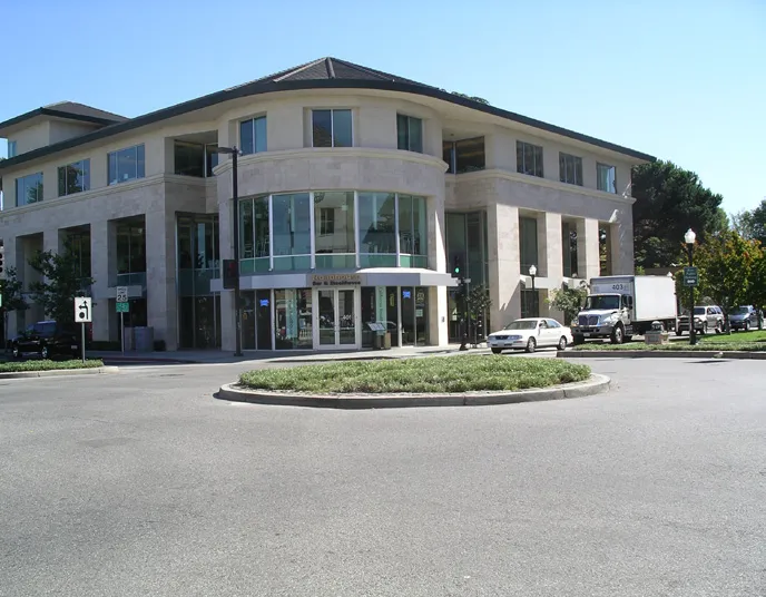Expressive building form in front of the larger manufacturing building