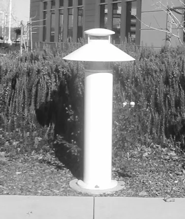 Light on a bollard adjacent to walking path.