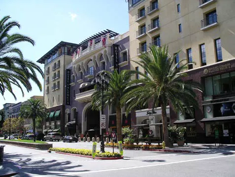 Street view of a five story mixed use building.