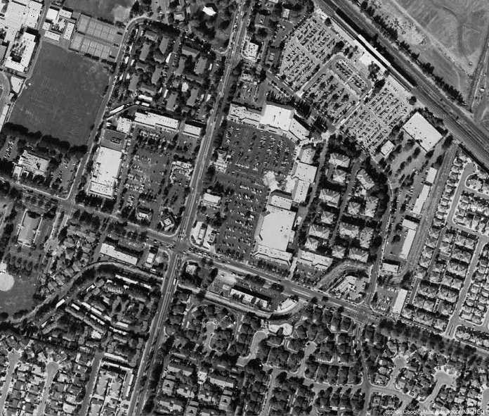 Aerial image of a typical commercial strip area with intermingled apartment projects.