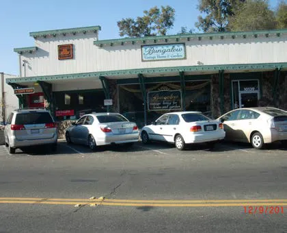 Angled on-street parking in front of multi-tenant commercial center.