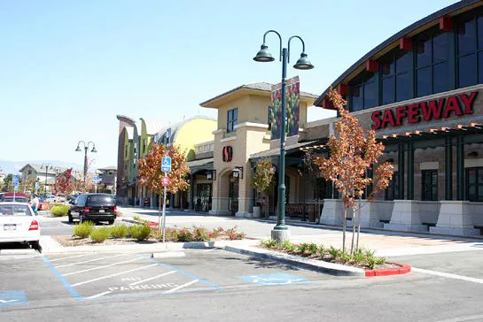 Multi-tenant commercial center with large walkable areas at the storefront.