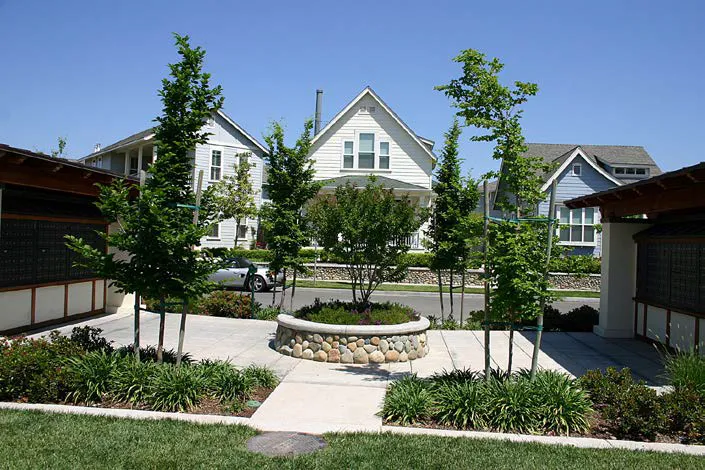 A plaza organized around the mailboxes of a residential community.