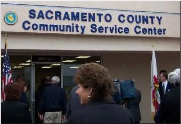 People entering a building with a sign over it that says "Sacramento County Community Service Center."