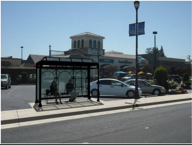 Covered bus shelter with glass canopy and walls
