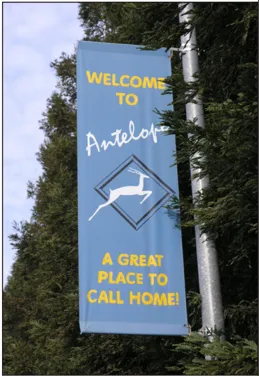 A blue banner on a pole that says "Welcome to Antelope, a great place to call home" and has a silhouette of an antelope.