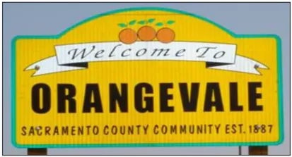A yellow sign that reads "Welcome to Orangevale, Sacramento County Community Est. 1887"