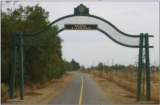 A gateway sign that reads "Rio Linda" over a trail.